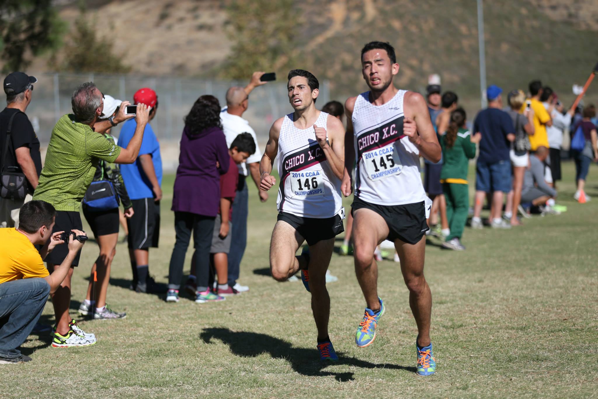 Teammates Nick Grubiss (r), Barron Maizland (l) battling hard down the home stretch on very warm day in San Bernardino,