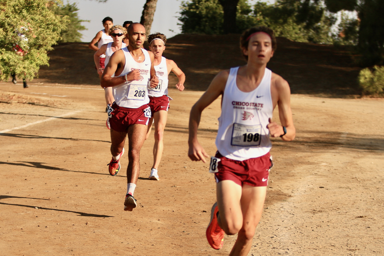 Mario Giannini breaking the race open in the 3rd mile with teammates following.
