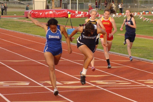 Wheatland Miya Wilson edges Pleasant Valley's Gabrielle Finley in girls 200m after losing to Finley in the 100m.(TC)