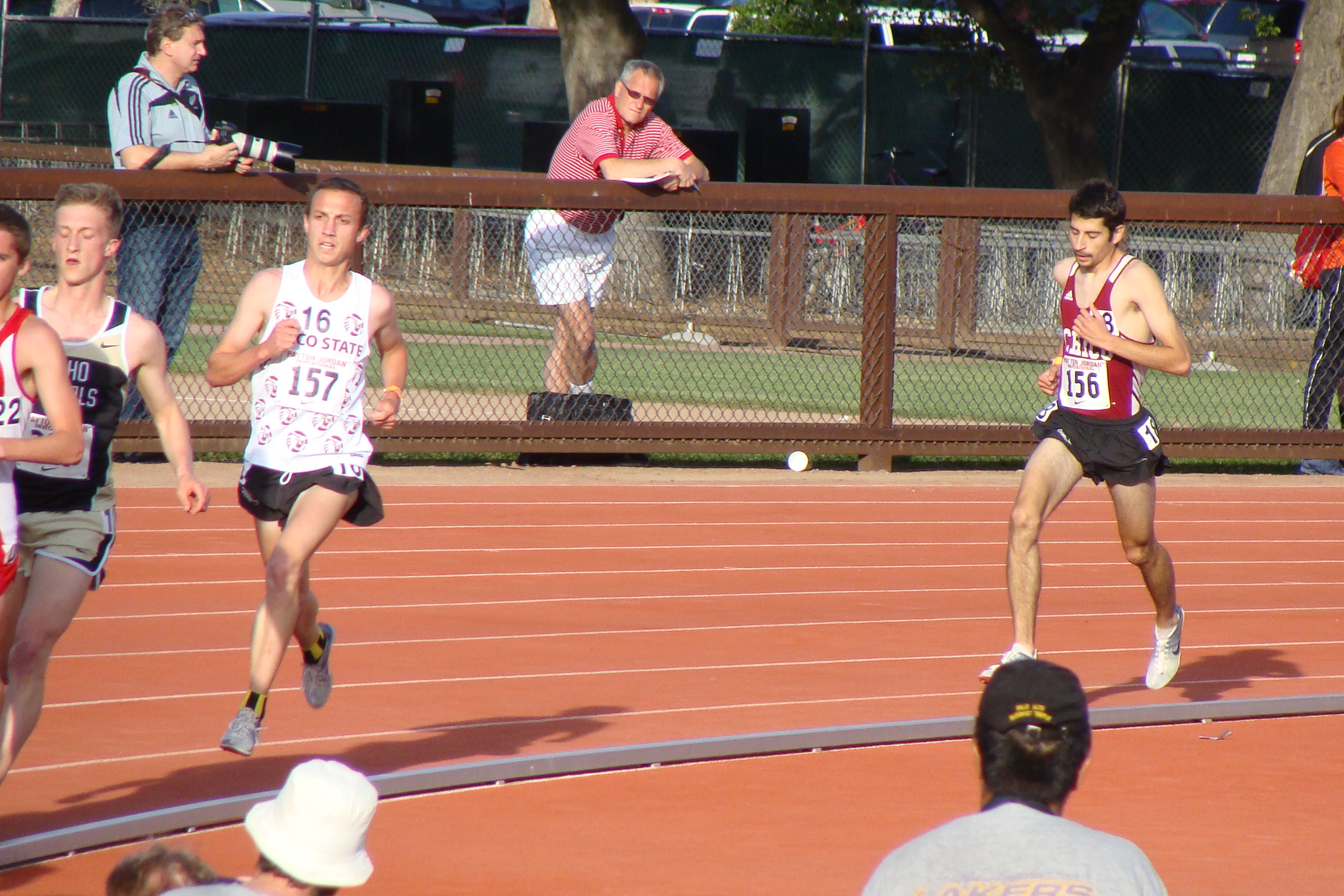 Midrace in a late afternoon heat of the 5K finds Bret Handa leading a fading Isaac Chavez. It turned out to be one of those days where allergies derailed Chavez effort where Handa slowed after a brisk eight laps