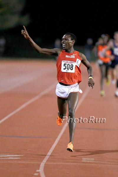 Bedan Karoki, seen here with his victory smile crossing the finish line, broke open a tight race in the men's Kim McDonald 10K by closing with a 8:30 3200m,