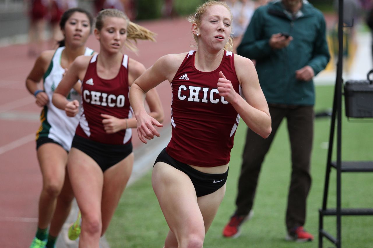 800/1500 runner Bailey Henshaw tows teammate Bekah Bahra through a mid race lap.