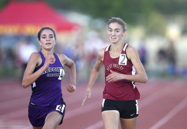 Redding Christian's Belle Moran just edges west Valley's Jenna Storms to win the girls 3200m in a personal best time of 11:15.43. (RS)