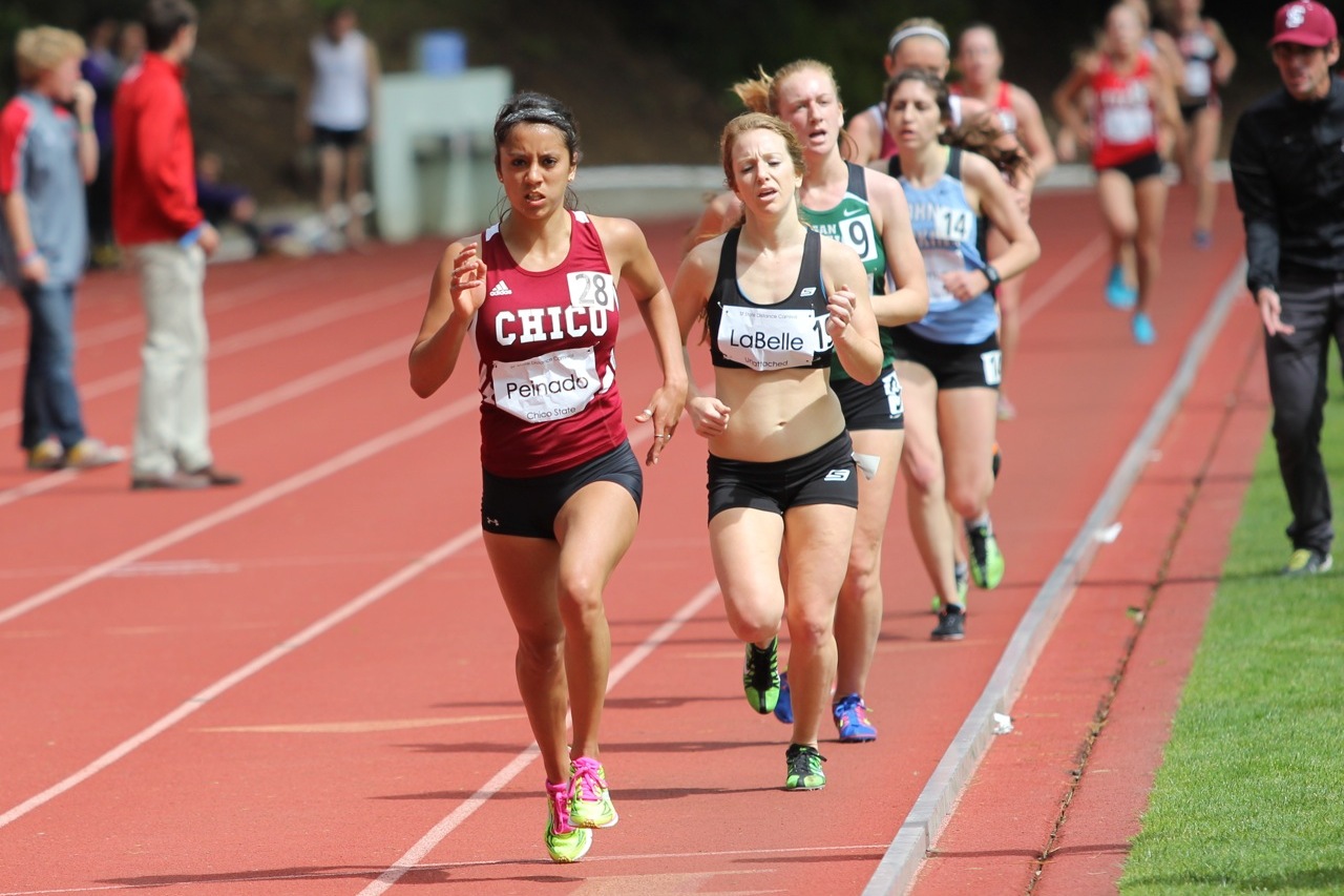 Quetta Peinado en route to a 17:34 5k PR. Shown here leading assistant coach Hillary LaBelle