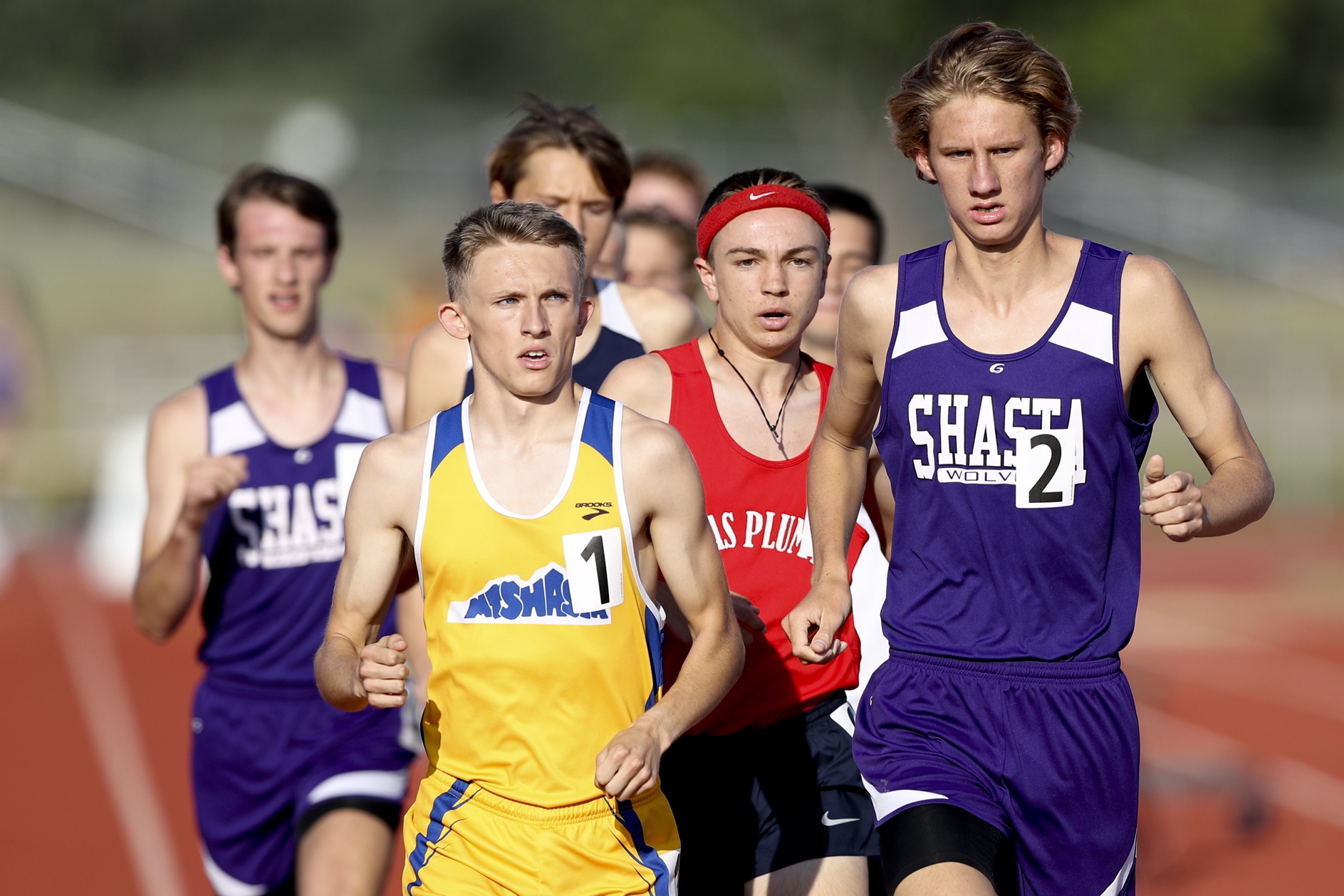 The field is bunched closely in the opening lap of the boys 1600m with Mt Shasta's Chris Morzenti, Shasta's Andrew Skoy and Las Plumas' Brian Hastings leading the way. (RS)