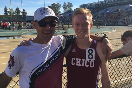 Coach Gary Towne congradulates Derek Morton after another strong effort in the 800m.