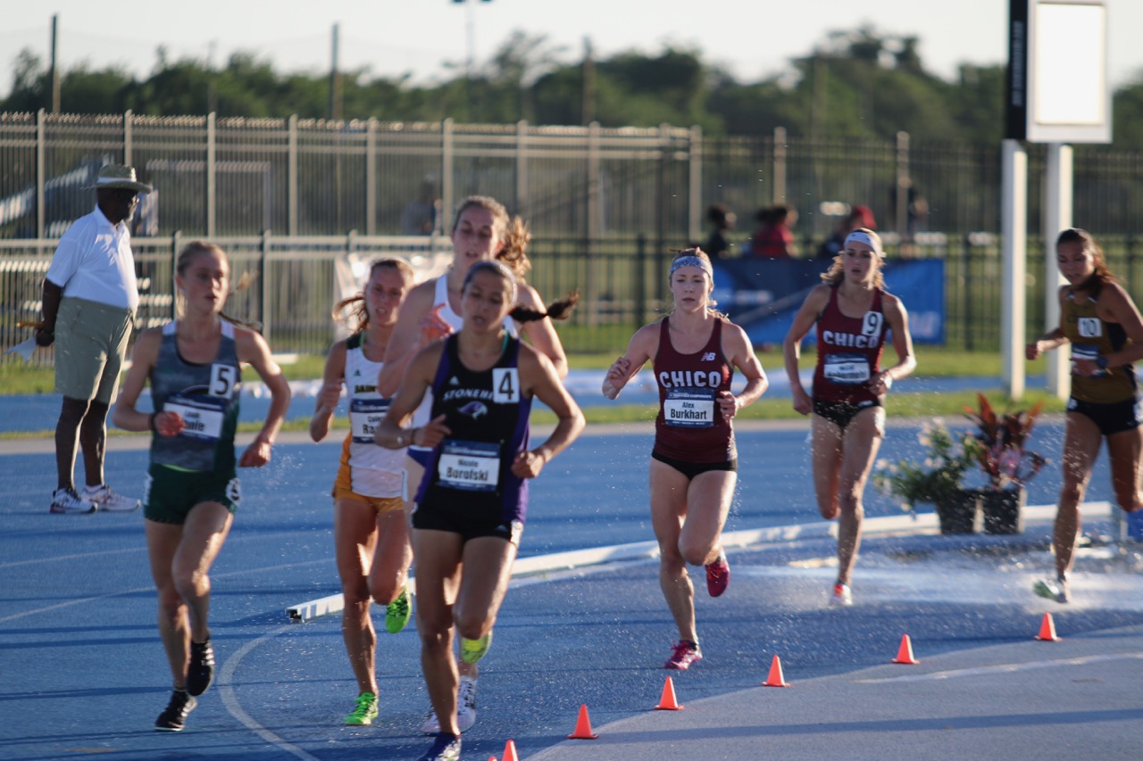 Alex Burkhart and McCall Habermehl chase the main pack in the women's steeple final.