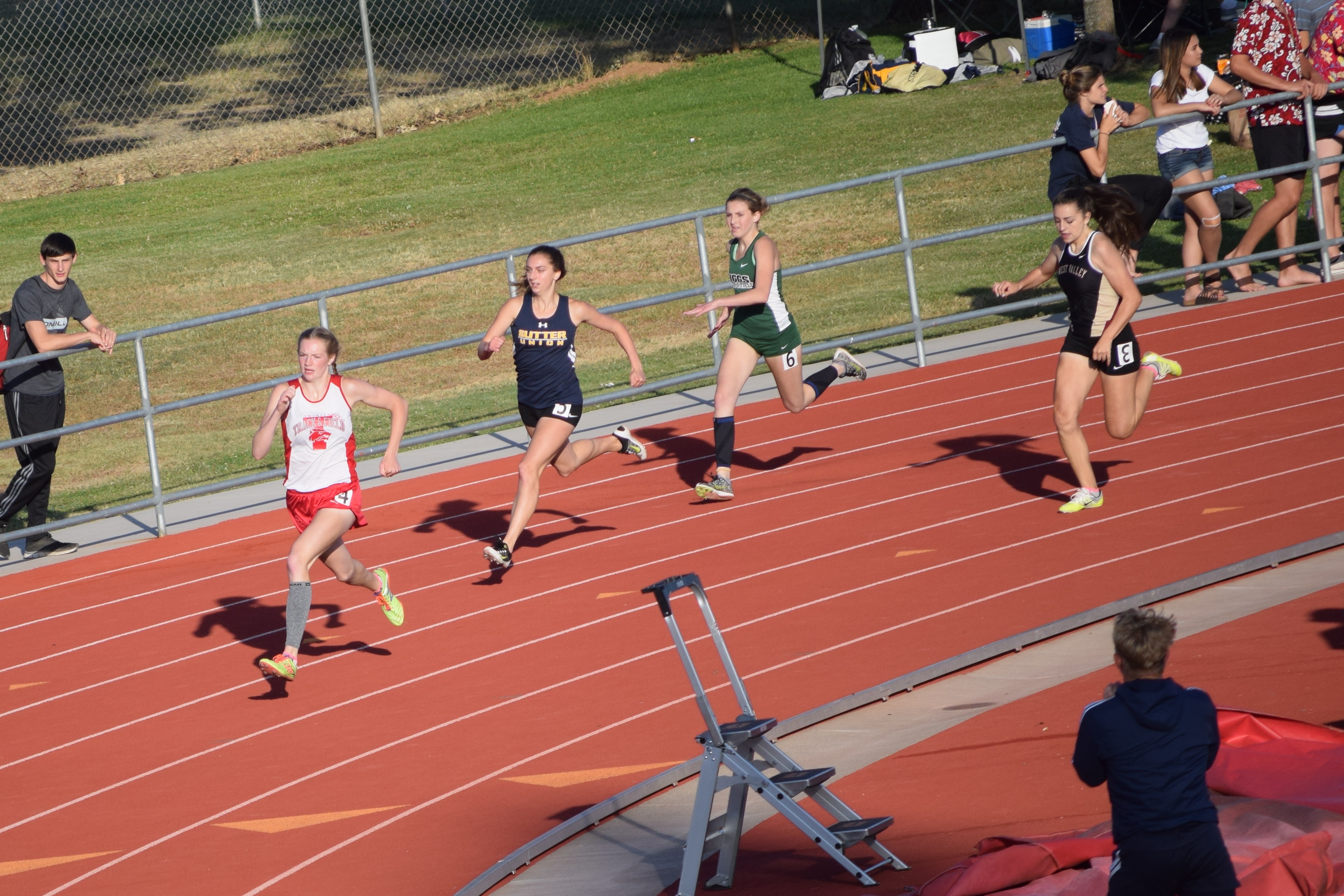 Trinity's Lauren Harper powers around the final turn in the girls 400m championship race in running one of the faster times at sections (57.35).(TC)