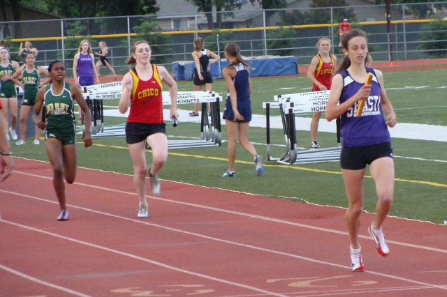 Shasta senior Lora James claims victory for the Wolves in the varsity girls 1600 relay, using the big gap her teammates gave her to crush the hopes of Chico and Red Bluff fans of an upset in the race.