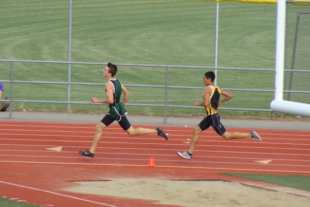 The cintilating distance race of the day was the epic dual between Paradise's Dylan Chamberlen and Enterprise's Domenic D'Acquisto. Never separated by more than a stride the entire race, the Hornet senior comes from behind to win.