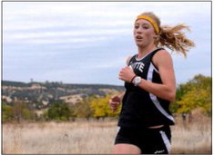 Butte College's top runner Sarah Brandt mid race on her way winning the race by almost a minute and a half.