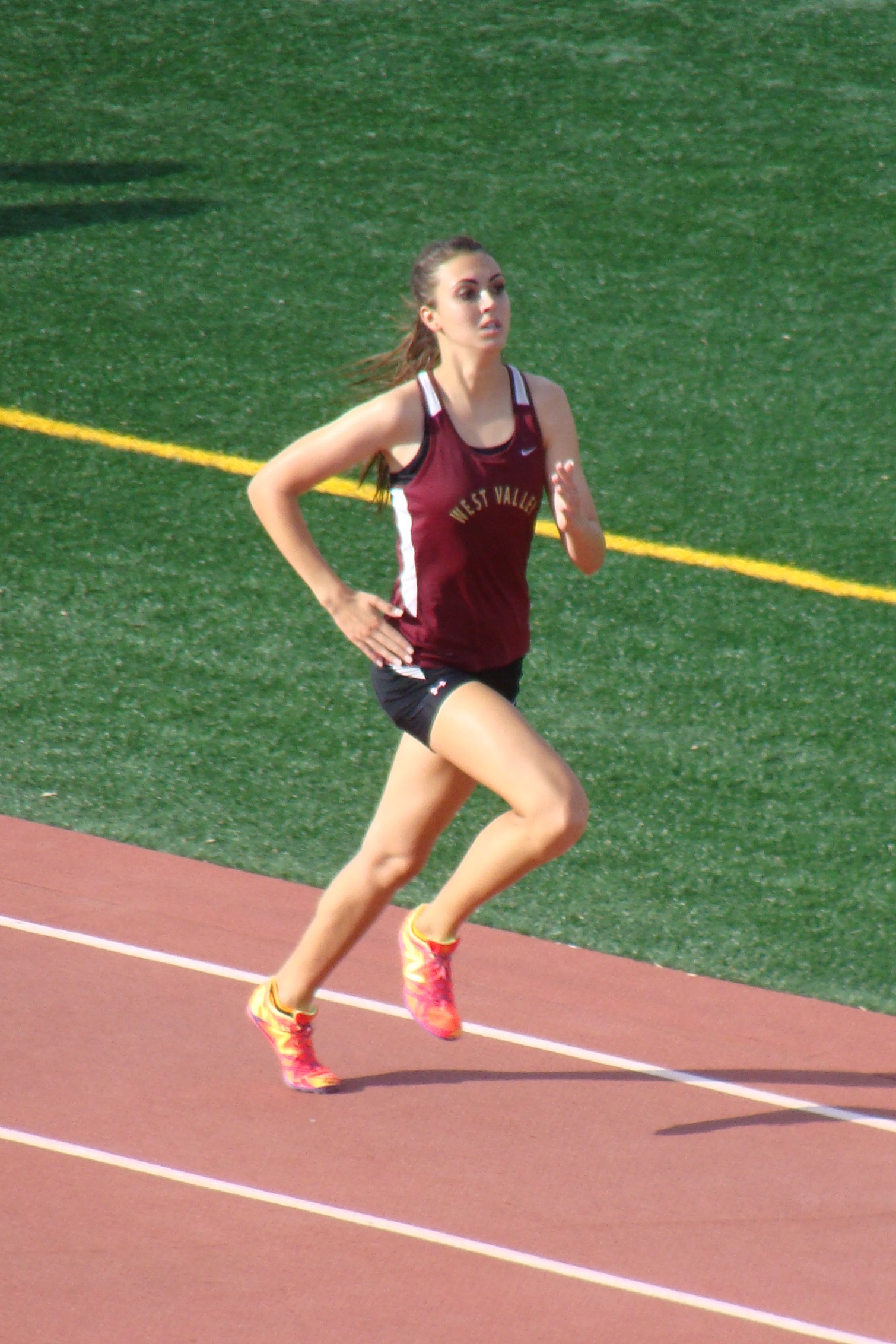 West Valley's Jenna Hinkle closing out a dominate win in the varsity girl's 1600. She would also come back to win the varsity girls 800, helping the Eagle to the Division championship. (TC)
