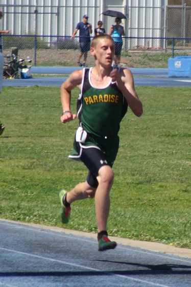 Paradise's Justin McGlone wins the EAL varsity boys 3200 by a comfortable margin, cruising home in 10:20.50