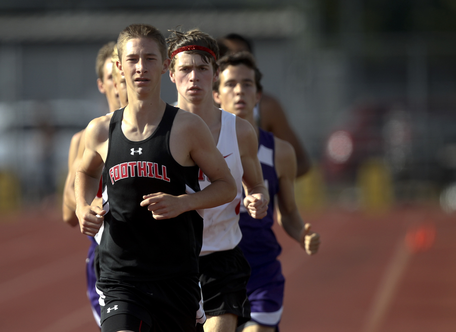 Foothill freshman Thurman Knowles was the early leader in both the varsity boys 1600m & 800m races. He would go on to place second in the 1600 & third in the 800m. The winner of both races, Chico's Jacob Graber, follows closely behind.(RS)