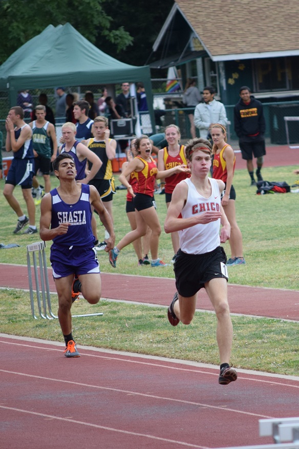 Chico's Jacob Graber pulls away from Shasta's coming down the final strait away in the varsity boys 800 at the EAL championships held at Paradise (much to the delight of some female teammates).