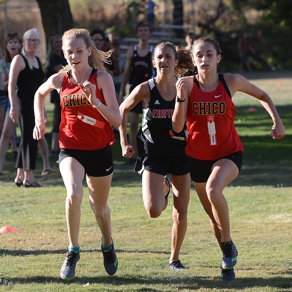 Chico's Britta Bundy and Nahkia Clements followed by Foothill's Rize Oliveira race towards the finish line during an Eastern Athletic-Sac River league cross country Wednesday September 27, 2017 at Hooker Oak Park in Chico, California. Bundy to come in first, Clements second and Oliveira third.(Emily Bertolino -- Enterprise-Record)