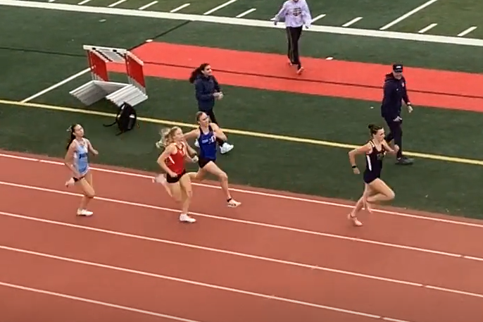 Four runners are in contention roughly 65m to go in the varsity girls 800m race. NU's Leah Krason leads at this point with Wellersdick & Hayes matching strides with PV's Avery Hankins in fourth.