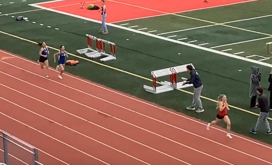 Chico senior Taylor Wellersdick holds a comfortable lead over CORE Butte's Brianna Hayes and Davis' Lillian Hales-Yang coming down the homestretch the final time in the varsity girls 1600m. All three would break five minutes.